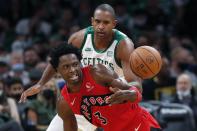 Toronto Raptors' OG Anunoby (3) loses control of the ball in front of Boston Celtics' Al Horford during the first half of an NBA basketball game, Friday, Oct. 22, 2021, in Boston. (AP Photo/Michael Dwyer)