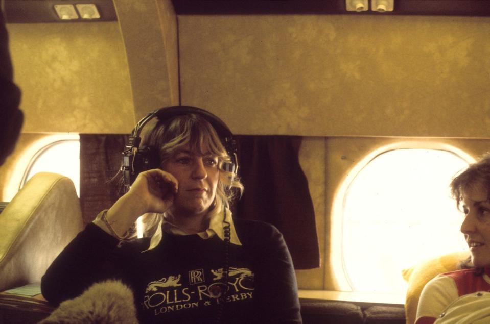 <p>Christine McVie of Fleetwood Mac sits on their private jet in 1975. </p>