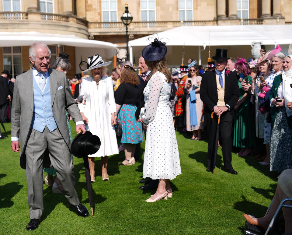 King Charles III and Queen Camilla at the Buckingham Palace garden party. (PA)