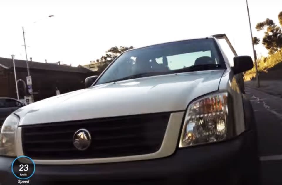 The white Holden Rodeo ute driver veers into the cyclist's lane and tries to veer him off the road. Photo: YouTube/Sean H