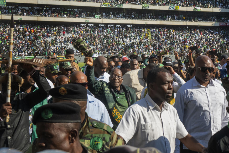 Former South African President Jacob Zuma arrives at Orlando stadium in the township of Soweto, Johannesburg, South Africa, for the launch of his newly formed uMkhonto weSizwe (MK) party's manifesto Saturday, May 18, 2024. Zuma, who has turned his back on the African National Congress (ANC) he once led, will face South African President Cyril Ramaphosa, who replaced him as leader of the ANC in a bitter battle in the general elections later in May. (AP Photo/Jerome Delay)