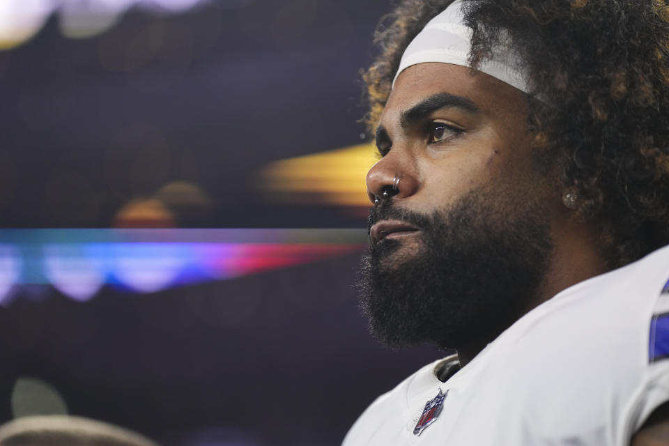 ARLINGTON, TX - DECEMBER 04: Ezekiel Elliott #21 of the Dallas Cowboys runs onto the field during introductions against the Indianapolis Coltsstands during the national anthem against the Indianapolis Colts at AT&T Stadium on December 4, 2022 in Arlington, Texas. (Photo by Cooper Neill/Getty Images)