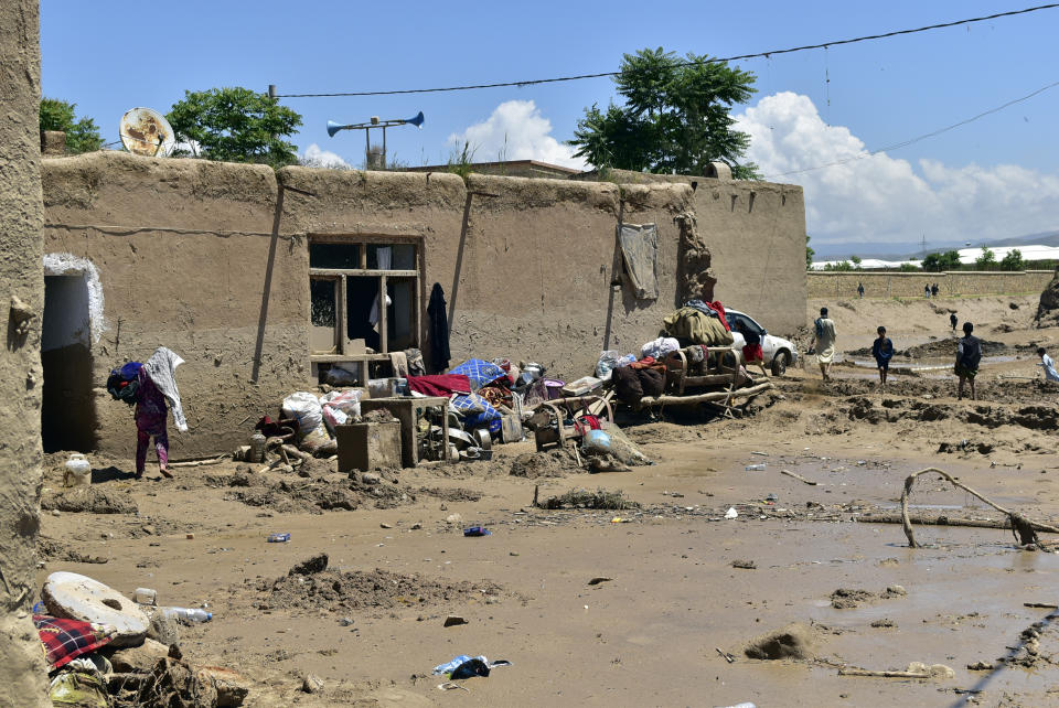 Belongings left outside after heavy flooding in Baghlan province in northern Afghanistan, Sunday, May 12, 2024. Victims of the devastating floods in northern Afghanistan are burying the dead and looking for the loved ones still missing. (AP Photo)