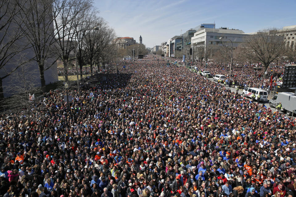 FILE - The crowd fills Pennsylvania Avenue during the "March for Our Lives" rally in support of gun control, Saturday, March 24, 2018, in Washington. In the wake of the shooting at Marjory Stoneman Douglas High School, teenaged survivors organized one of the largest youth protests in history in D.C., rallying over a million activists in sister marches from California to Japan. (AP Photo/Alex Brandon, File)