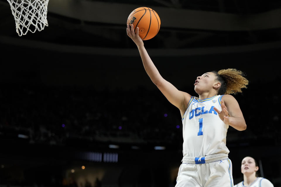 UCLA guard Kiki Rice (1) puts up a shot against the LSU during the second quarter of a Sweet Sixteen round college basketball game during the NCAA Tournament, Saturday, March 30, 2024, in Albany, N.Y. (AP Photo/Hans Pennink)