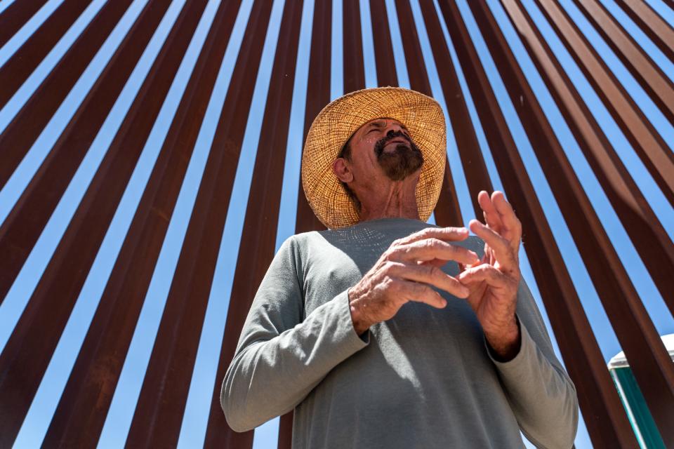 Luis Ames, a local agricultural worker, stands along the U.S.-Mexico border after dropping off water for migrants and asylum seekers detained by U.S. Border Patrol agents in San Luis, Ariz., on May 11, 2023.