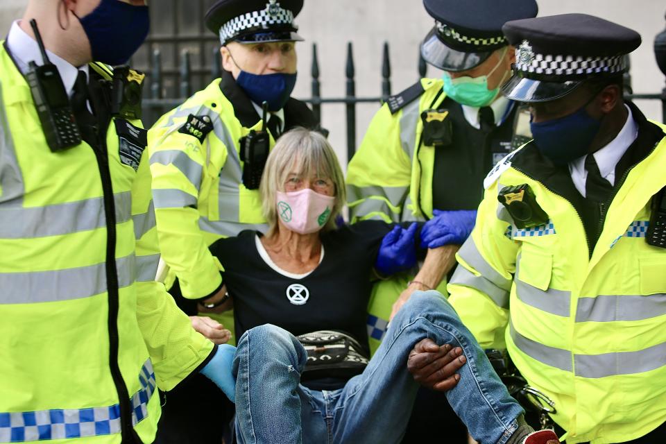 LONDON, UNITED KINGDOM - SEPTEMBER 1: Police officers make an arrest as Extinction Rebellion protestors demonstrate in London, United Kingdom on September 01, 2020. The group are calling for MPs to support The Climate and Ecological Emergency Bill (CEE Bill). (Photo by Hasan Esen/Anadolu Agency via Getty Images)