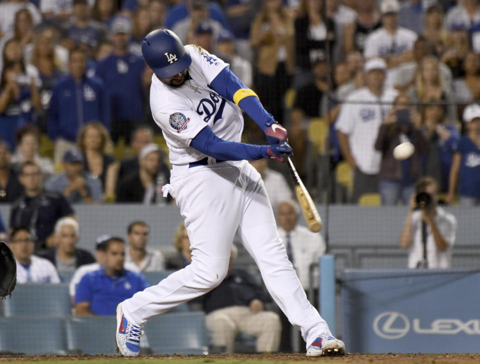 Los Angeles Dodgers' Matt Kemp hits a three-run homer in the eighth inning of a baseball game against the Arizona Diamondbacks, Saturday, Sept. 1, 2018, in Los Angeles. (AP Photo/Michael Owen Baker)