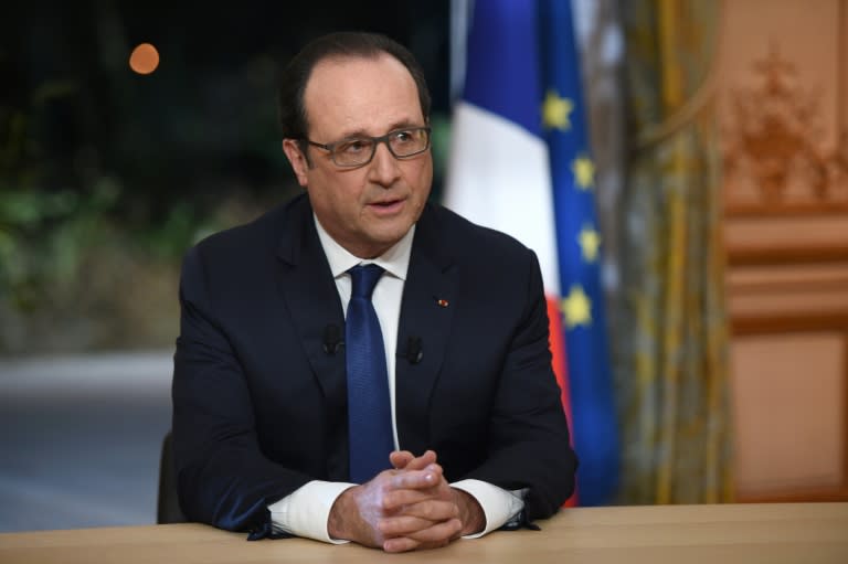 President Francois Hollande prepares to speak as part of an interview during the French evening news on TF1 and France 2, on February 11, 2016 at the Elysee palace in Paris