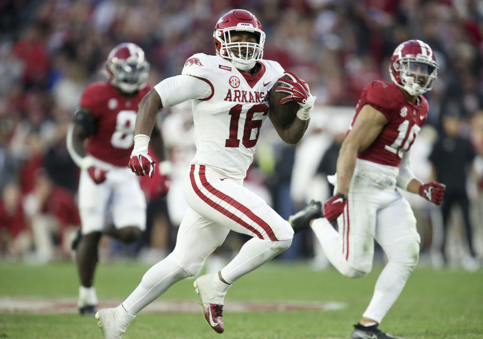 Nov 20, 2021; Tuscaloosa, Alabama, USA; Arkansas Razorbacks wide receiver Treylon Burks (16) runs for a touchdown after making a catch against Alabama Crimson Tide at Bryant-Denny Stadium. Alabama won 42-35. Mandatory Credit: Gary Cosby Jr.-USA TODAY Sports