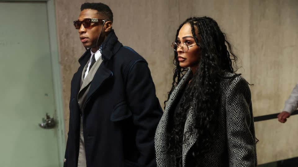 Jonathan Majors arrives with Meagan Good for jury selection in his assault and harassment case at Manhattan Criminal Court in New York City on November 29, 2023. - Shannon Stapleton/Reuters