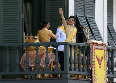 Thailand's newly crowned King Maha Vajiralongkorn, Queen Suthida and Princess Sirivannavari Nariratana are seen at the balcony of Suddhaisavarya Prasad Hall at the Grand Palace where King grants a public audience to receive the good wishes of the people in Bangkok, Thailand May 6, 2019.REUTERS/Athit Perawongmetha