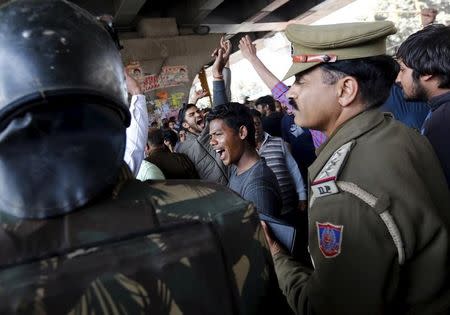 Demonstrators from the Jat community shout slogans next to police during a protest in New Delhi, India, February 21, 2016. REUTERS/Adnan Abidi