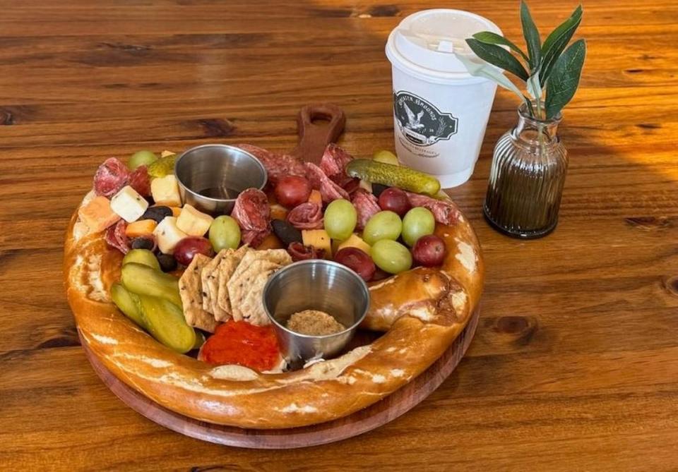 The Greater Grounds Coffee & Co. menu includes “The Great Charcuterie Pretzel,” a jumbo pretzel serves surrounded with meats, cheeses and jelly.