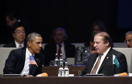 U.S. President Barack Obama listens to Pakistan's Prime Minister Nawaz Sharif (R) during the opening session of the Nuclear Security Summit in The Hague March 24, 2014. REUTERS/Yves Herman/Files