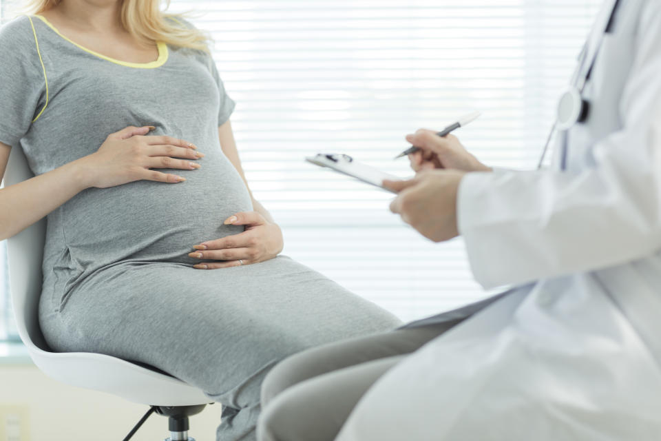 Doctor talking to a pregnant patient