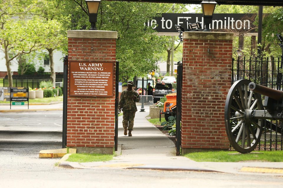 A soldier exits the Fort Hamilton military base in Brooklyn where a pizza delivery man was detained and questioned before being reported to&nbsp;Immigration and Customs Enforcement. (Photo: Spencer Platt via Getty Images)