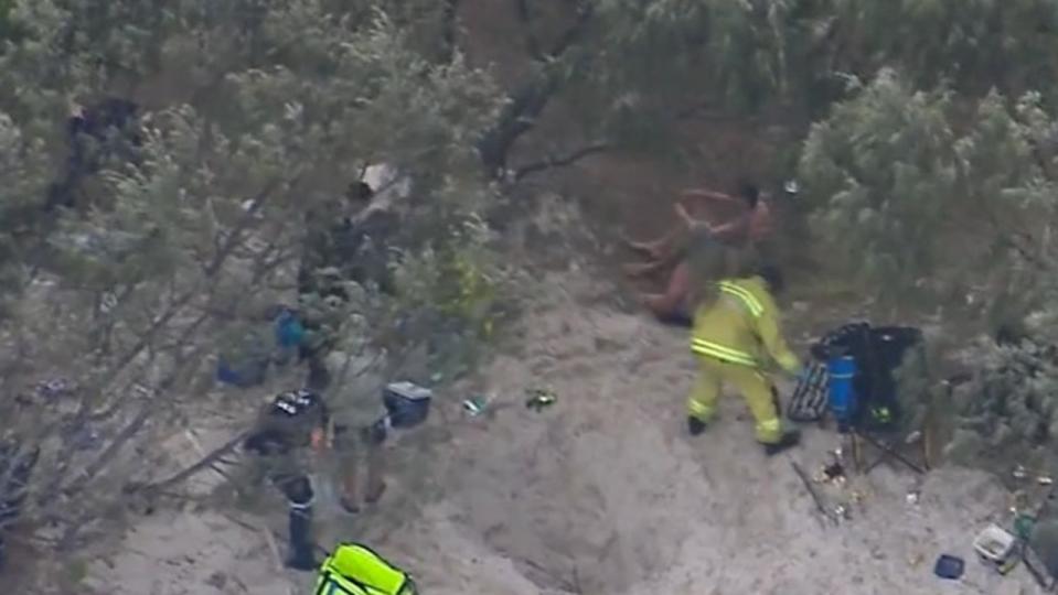 The young man was underneath the sand for an extended period of time. Picture: Nine News