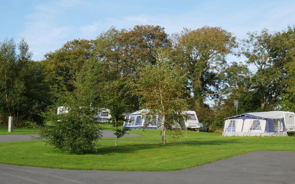 A woman is fighting for her life and three others were injured after a vehicle ploughed through tents at a country campsite - Wales News Service Ltd.