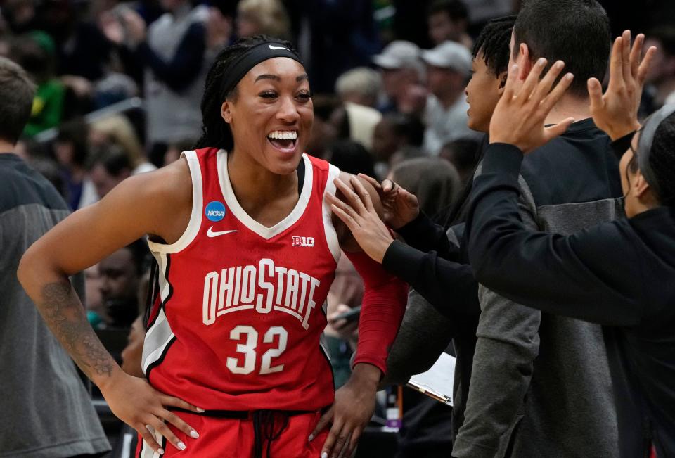 March 25, 2023; Seattle, WA, USA; Ohio State Buckeyes forward Cotie McMahon (32) celebrates on the bench near the end of an NCAA Tournament Sweet Sixteen game against the UConn Huskies at Climate Pledge Arena in Seattle on Saturday. Ohio State won the game 73-61 and advances to the Elite Eight. Mandatory Credit: Barbara J. Perenic/Columbus Dispatch