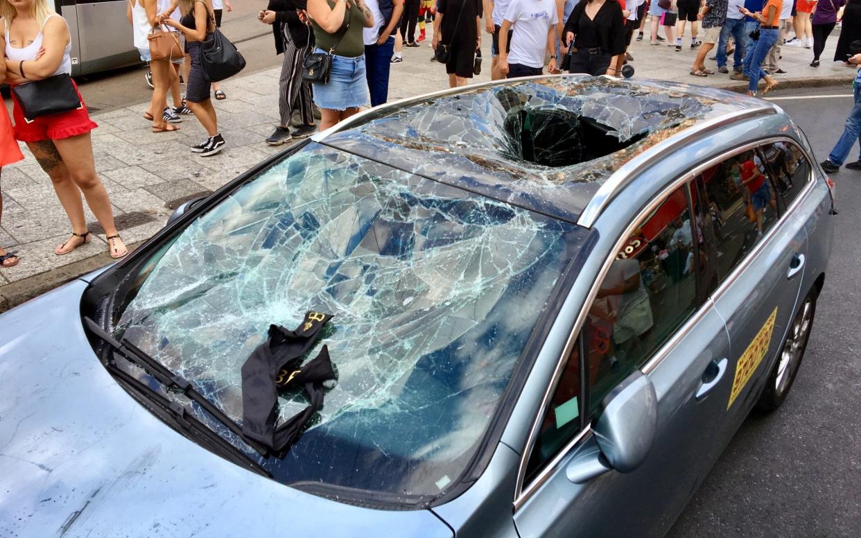 A taxi was damaged after football fans went into the city centre from Nottingham Castle after an England - Dan Westwell