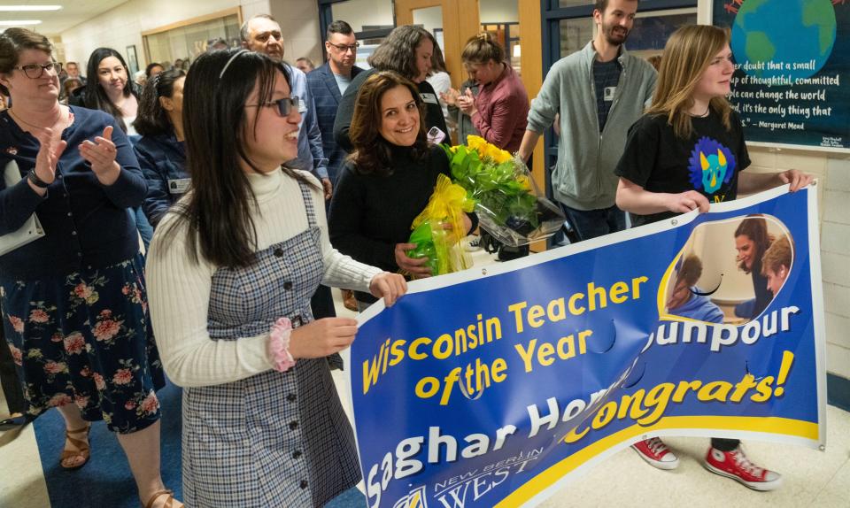 Computer science teacher Saghar Homayounpour walks through the hall to the applause of students and staff after being recognized as a 2024 Wisconsin Teacher of the Year during a surprise ceremony on May 1 at New Berlin West High School. She is the first of five teachers to be surprised with 2024 Wisconsin Teacher of the Year awards.