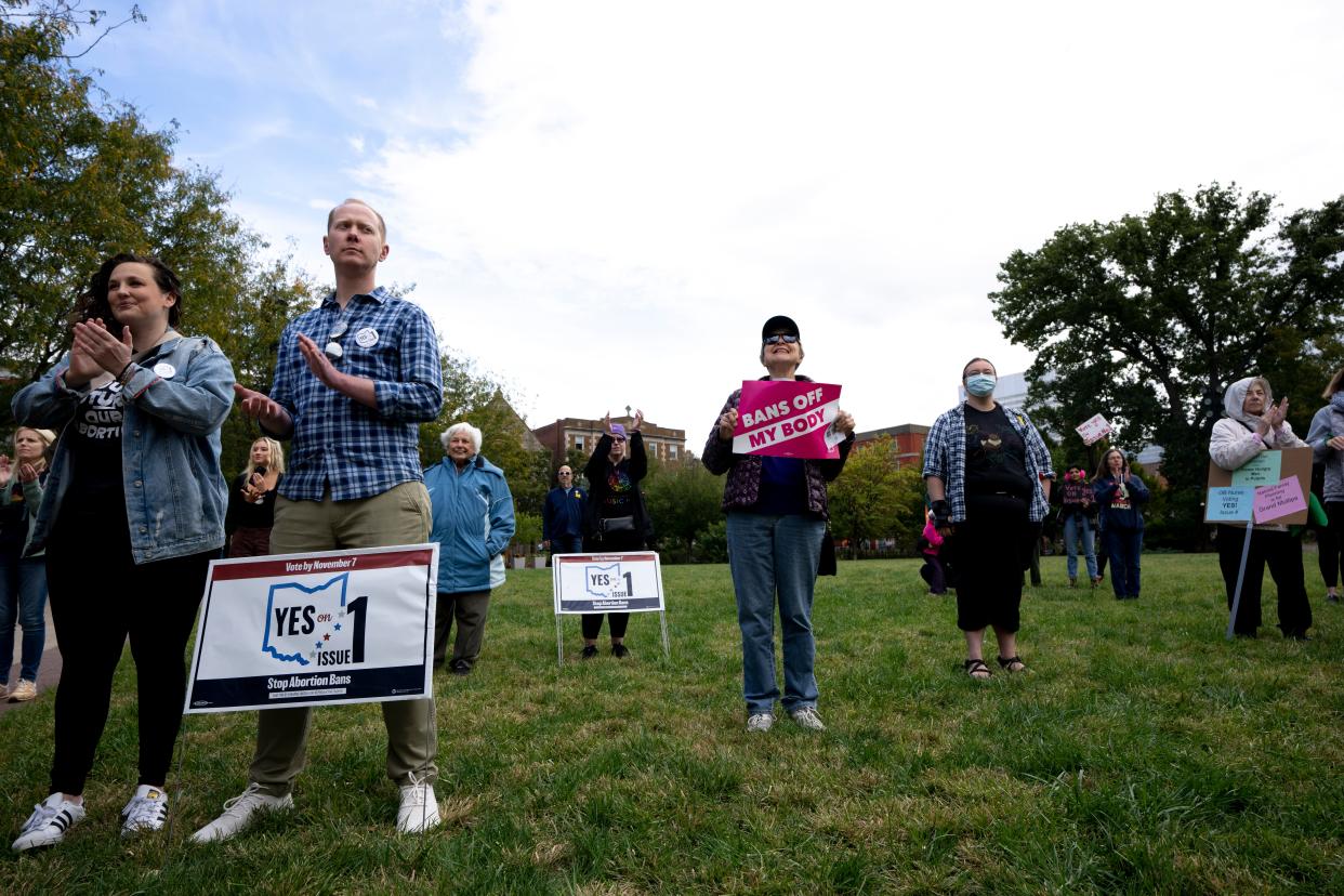 People clap while supporting speakers at the “Bans Off Ohio Day of Action” rally at Washington Park in Cincinnati on Oct. 8.