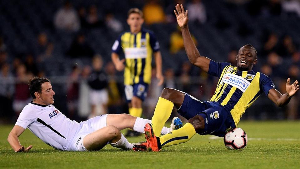 Usain Bolt (r) scored twice for the Mariners against Macarthur South West Utd in their trial match. Pic: Getty