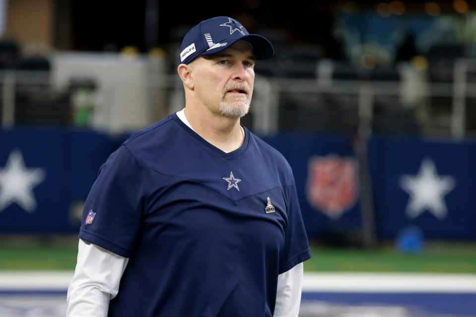 Dallas Cowboys defensive coordinator Dan Quinn watches team warmups before the first half an NFL football game against the Atlanta Falcons in Arlington, Texas, Sunday, Nov. 14, 2021.