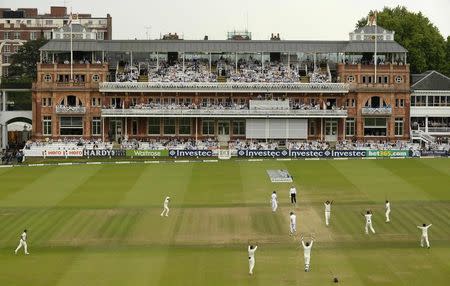 India's Ishant Sharma celebrates as England's Moeen Ali is dismissed for 12 runs during the second cricket test match at Lord's cricket ground in London July 21, 2014. REUTERS/Philip Brown