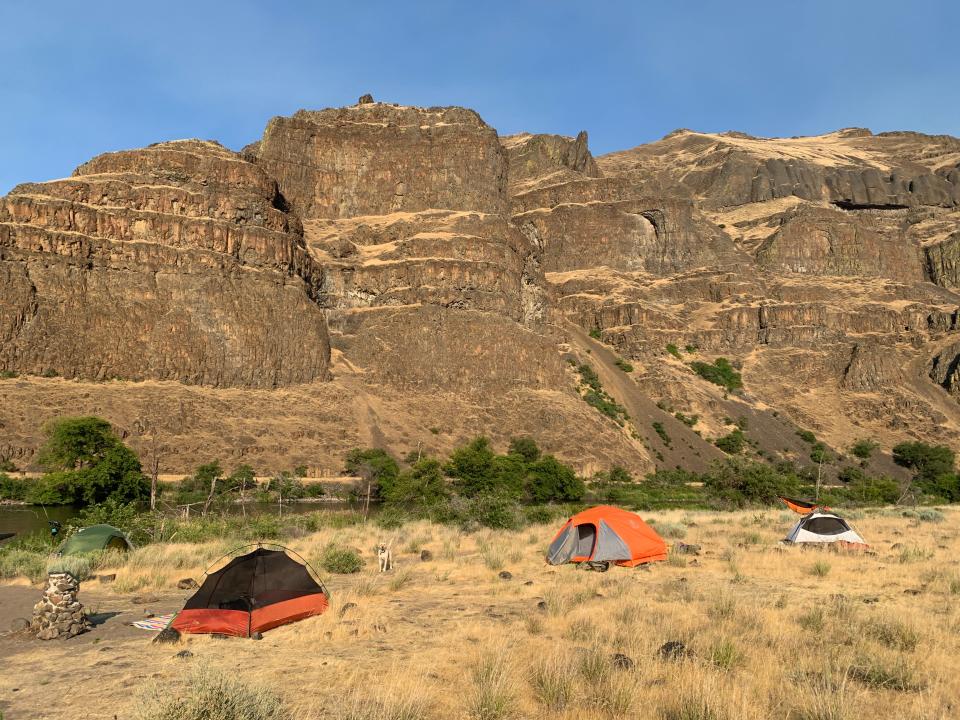 A campsite on the Lower Deschutes River in a big desert canyon.