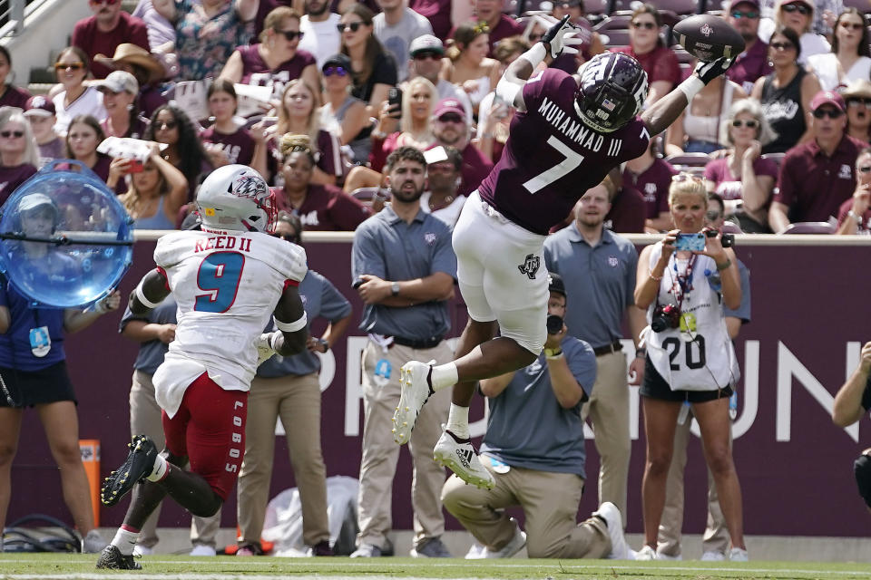 Texas A&M wide receiver Moose Muhammad III (7) makes a one-handed catch for a touchdown in front of New Mexico safety Jerrick Reed II (9) during the second half of an NCAA college football game on Saturday, Sept. 18, 2021, in College Station, Texas. (AP Photo/Sam Craft)