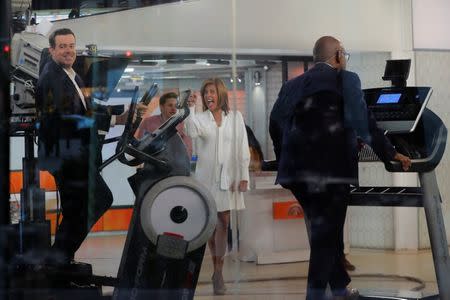 Co-host Hoda Kotb (C) laughs as Carson Daily and Al Roker demonstrate exercise machines on NBC's Today Show in New York, U.S., January 3, 2018. REUTERS/Lucas Jackson