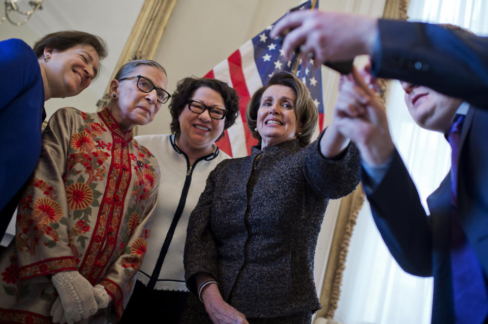 House Minority Leader Nancy Pelosi (D-Calif.) right, prepares to take a picture in her Capitol office with Supreme Court Justices, from left, Elena Kagan, Ruth Bader Ginsburg and Sonia Sotomayor, before a reception on March 18, 2015. The justices were in the Capitol to be honored at Pelosi's annual Women's History Month reception in Statuary Hall.