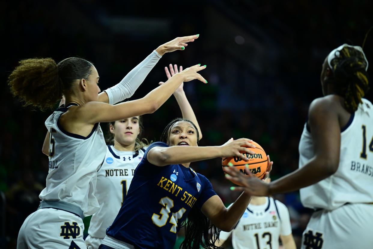 Kent State's Janae Tyler looks to go up with a shot while being surrounded by Notre Dame defenders during an NCAA Tournament first-round game Saturday in South Bend, Ind.
