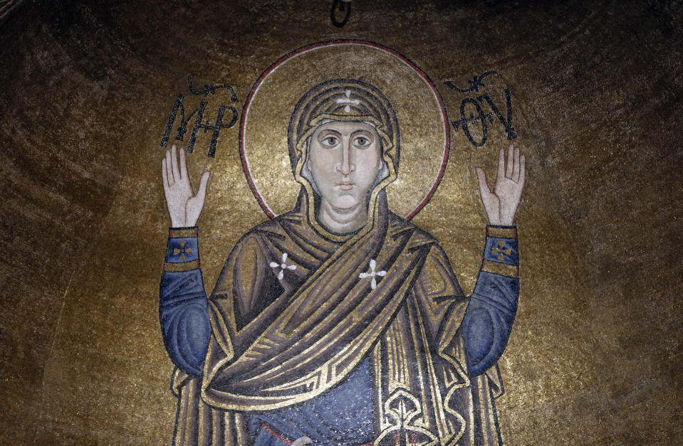 A view of the Mosaic Oranta, an Orthodox Christian depiction of the Virgin Mary in prayer with extended arms, from the 11th century, 6 meter high, dominates the interior of the St.Sophia Cathedral in Kiev, Ukraine, Monday, Jan. 7, 2019. Ukraine marks Orthodox Christmas and celebrates the independence of the Ukrainian Orthodox Church in the St. Sophia Cathedral. (AP Photo/Efrem Lukatsky)