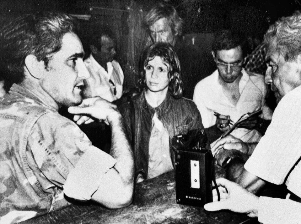 FILE - In this May 30, 1984 file photo, rebel leader Eden Pastora, left, speaks with members of the media moments before a bomb went off, killing an American journalist and several other people in La Penca, Nicaragua, at a rebel camp. Pastora, one of the most mercurial, charismatic figures of Central America’s revolutionary upheavals, has died. His son Alvaro Pastora said Tuesday, June 16, 2020 that he died at Managua’s Military Hospital of respiratory failure. (AP Photo, File)