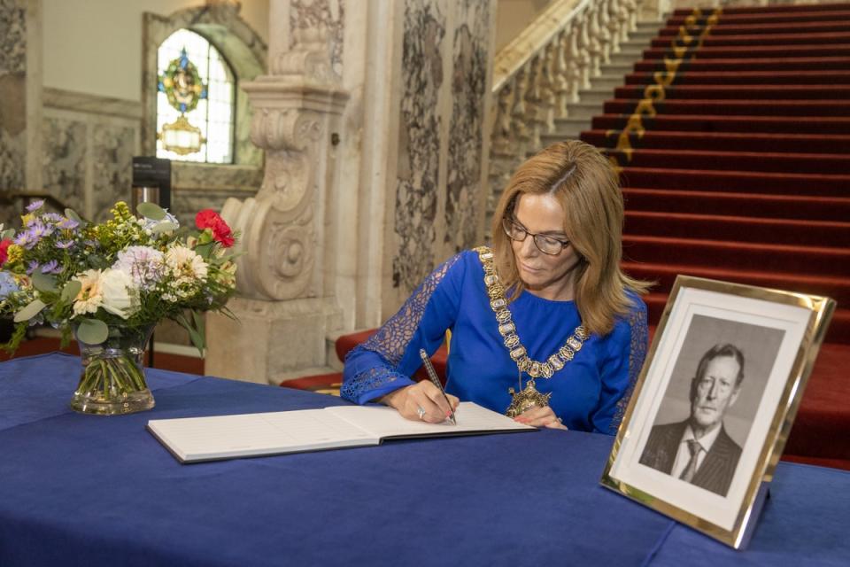 Lord Mayor of Belfast Tina Black opens a book of condolence at Belfast City Hall for former Northern Ireland First Minister and leader of the Ulster Unionist Party Lord David Trimble (Liam McBurney/PA) (PA Wire)