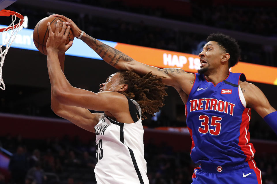 Detroit Pistons forward Christian Wood (35) blocks a shot from Brooklyn Nets forward Nicolas Claxton (33) in the first half of an NBA basketball game in Detroit, Saturday, Jan. 25, 2020. (AP Photo/Paul Sancya)