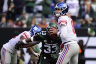 New York Giants quarterback Daniel Jones (8) looks to pass as New York Jets' Jamal Adams (33) closes in during the first half of an NFL football game Sunday, Nov. 10, 2019, in East Rutherford, N.J. Adams forced a fumble on the play. (AP Photo/Steven Ryan)