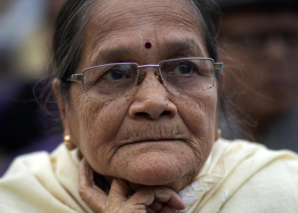 In this Monday, Dec. 23, 2019, photo, Runu Goswami, 77, participates in a protest against the Citizenship Amendment Act in Gauhati, India. Tens of thousands of protesters have taken to India’s streets to call for the revocation of the law, which critics say is the latest effort by Narendra Modi’s government to marginalize the country’s 200 million Muslims. Goswami said her heart broke when she heard the news of a boy being killed in police firing and asked how a student could be killed for protesting against the act. (AP Photo/Anupam Nath)