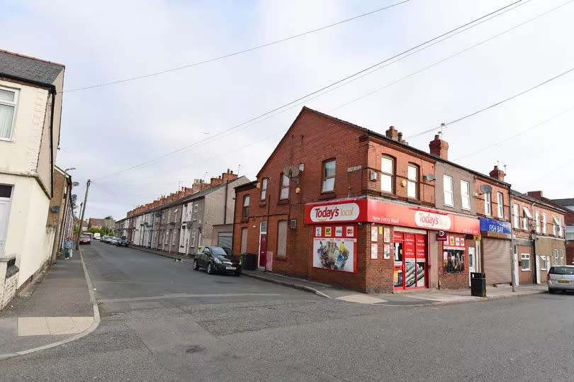 Police were called to reports that two men were smashing car windscreens parked on Napier Road (left), just off New Ferry Road