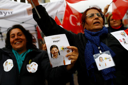 FILE PHOTO: "Hayir", "No" in English, supporters hold Turkish flags and leaflets for the upcoming referendum at a campaign point in Istanbul, Turkey, March 31, 2017. REUTERS/Murad Sezer/File Photo