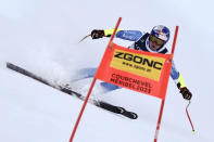 France's Alexis Pinturault speeds down the course during the super G portion of an alpine ski, men's World Championship combined race, in Courchevel, France, Tuesday, Feb. 7, 2023. (AP Photo/Gabriele Facciotti)