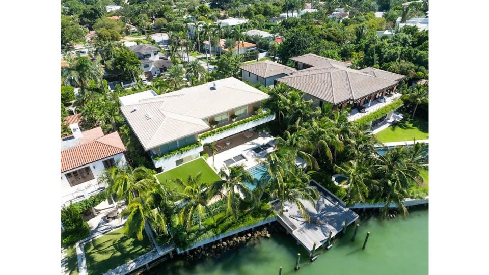 View of Cindy Crawford's Miami Beach home, revealing a swimming pool, and dock