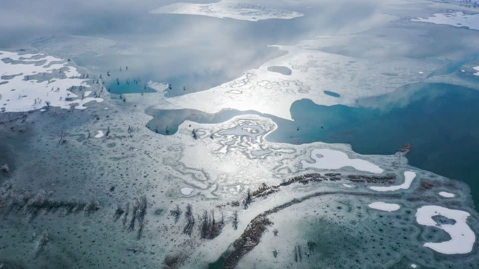 Aerial view of snow covering on Lop Nur lake and Taklamakan Desert at Yuli County on November 28, 2021, in Bayingolin Mongol Autonomous Prefecture, Xinjiang Uygur Autonomous Region of China.  - Yang Kun/VCG/Getty Images