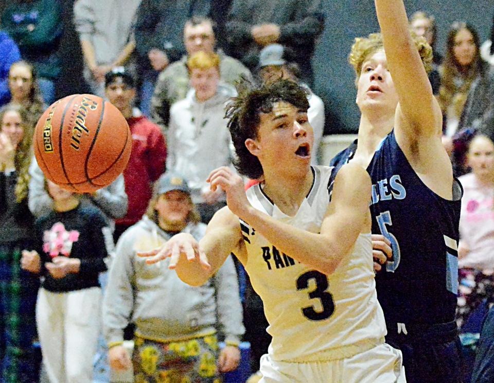 Great Plains Lutheran's Brody Scharlemann dishes off the ball while being guarded by Sioux Falls Lutheran's Grant Prouty during their high school boys basketball game on Friday, Jan. 20, 2023 in Watertown.