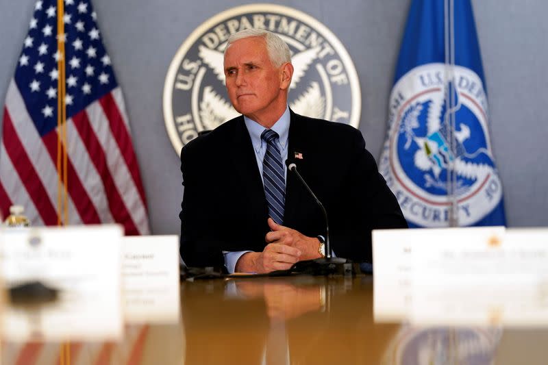 FILE PHOTO: Vice President Mike Pence listens during a briefing about the upcoming presidential inauguration of President-elect Joe Biden and Vice President-elect Kamala Harris, at FEMA headquarters