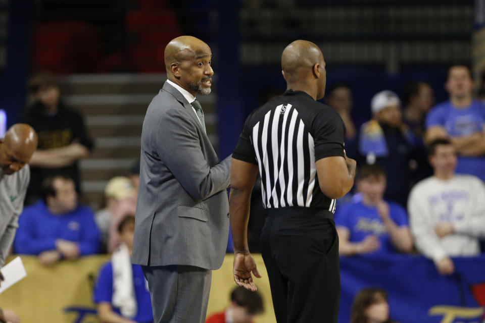 South Florida head coach Amir Abdur-Rahim talks to a referee against Tulsa during the first half of an NCAA college basketball game, Saturday, March 9, 2024, in Tulsa, Okla. (AP Photo/Joey Johnson)