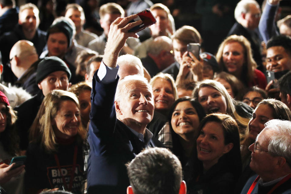 Democratic presidential candidate former Vice President Joe Biden walks in the crowd at a caucus night campaign rally on Monday, Feb. 3, 2020, in Des Moines, Iowa. (AP Photo/John Locher)